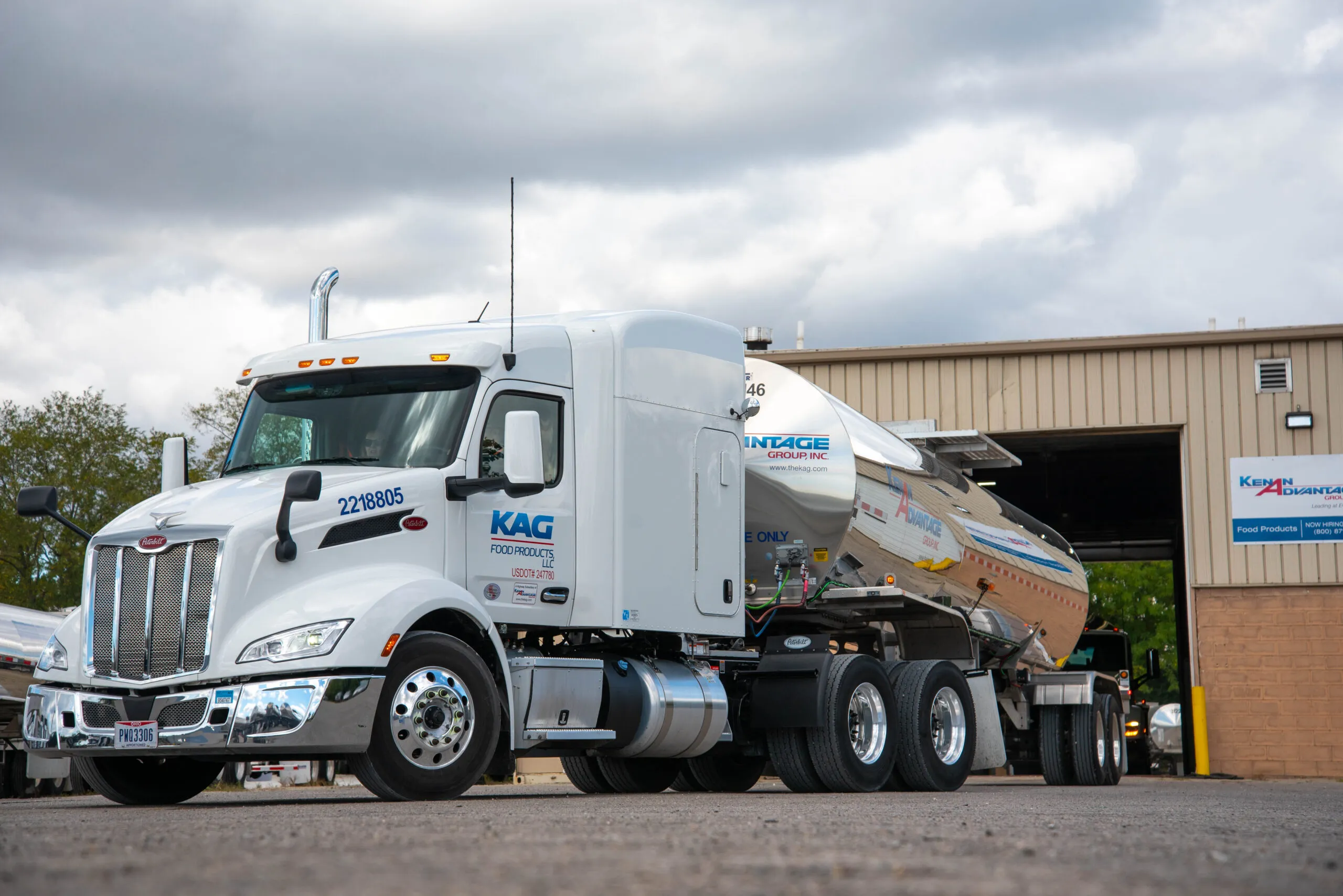 White KAG Food Products tanker truck parked outside a Kenan Advantage Group facility