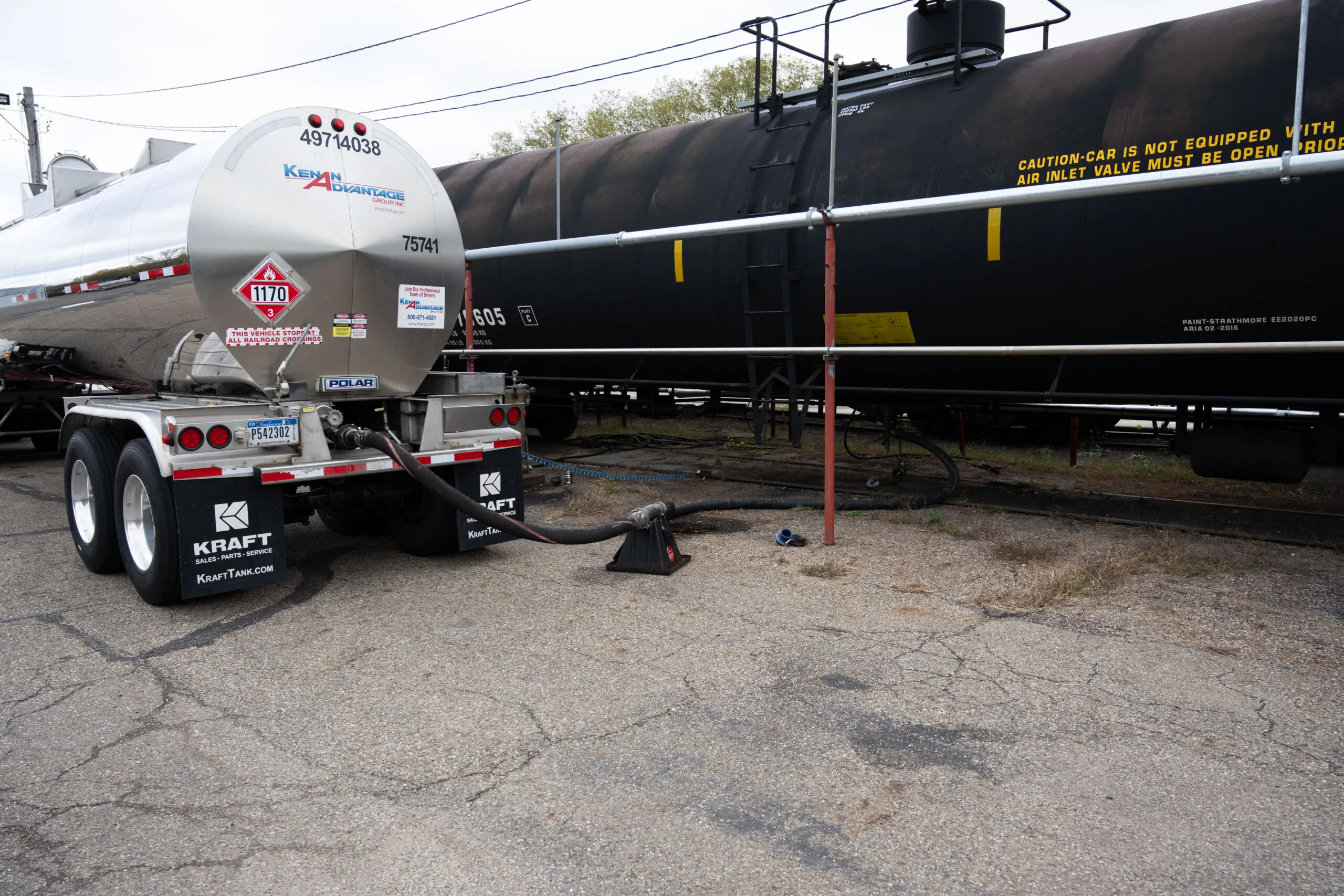 KAG tanker trailer connected to a rail tank car at a transloading facility