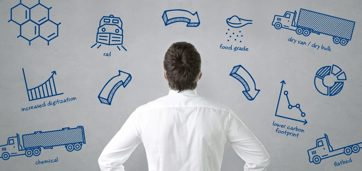 Man viewing hand-drawn icons for rail, chemical, food grade, and flatbed transport options