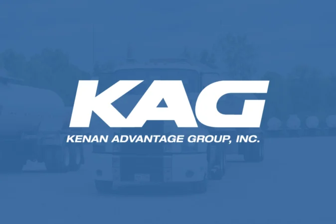 KAG — Kenan Advantage Group, Inc. logo on a blue-tinted background with trucks visible behind it