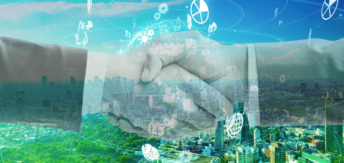 Business handshake overlaid on a city skyline with sustainability and technology icons representing a green partnership