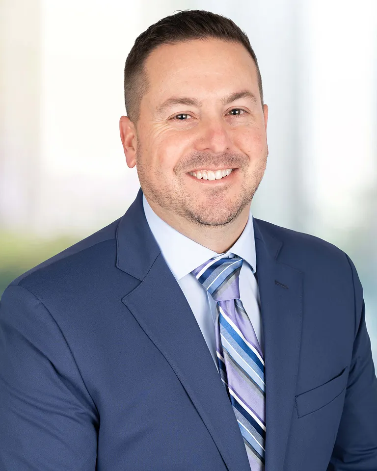 Professional headshot of KAG's chief people officer Kyle Mitchin.